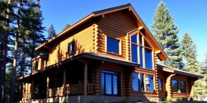 Cozy log home addition blends with existing structure.