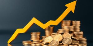Upward trending arrow amidst rising coins.